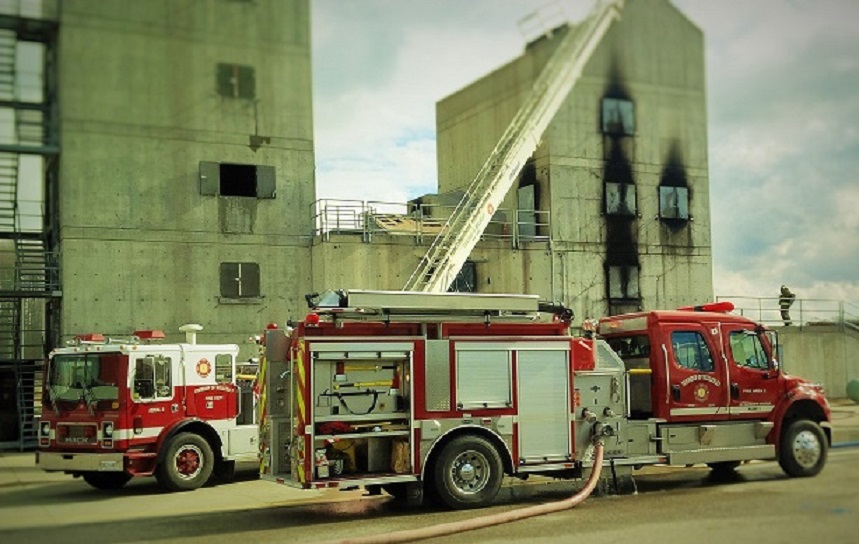 Two fire trucks at training facility for fire fighter practice